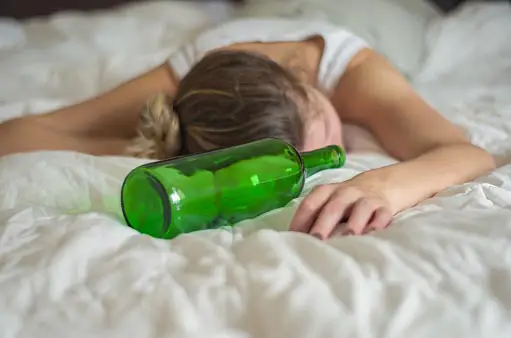 woman sleeping after drinking alcohol